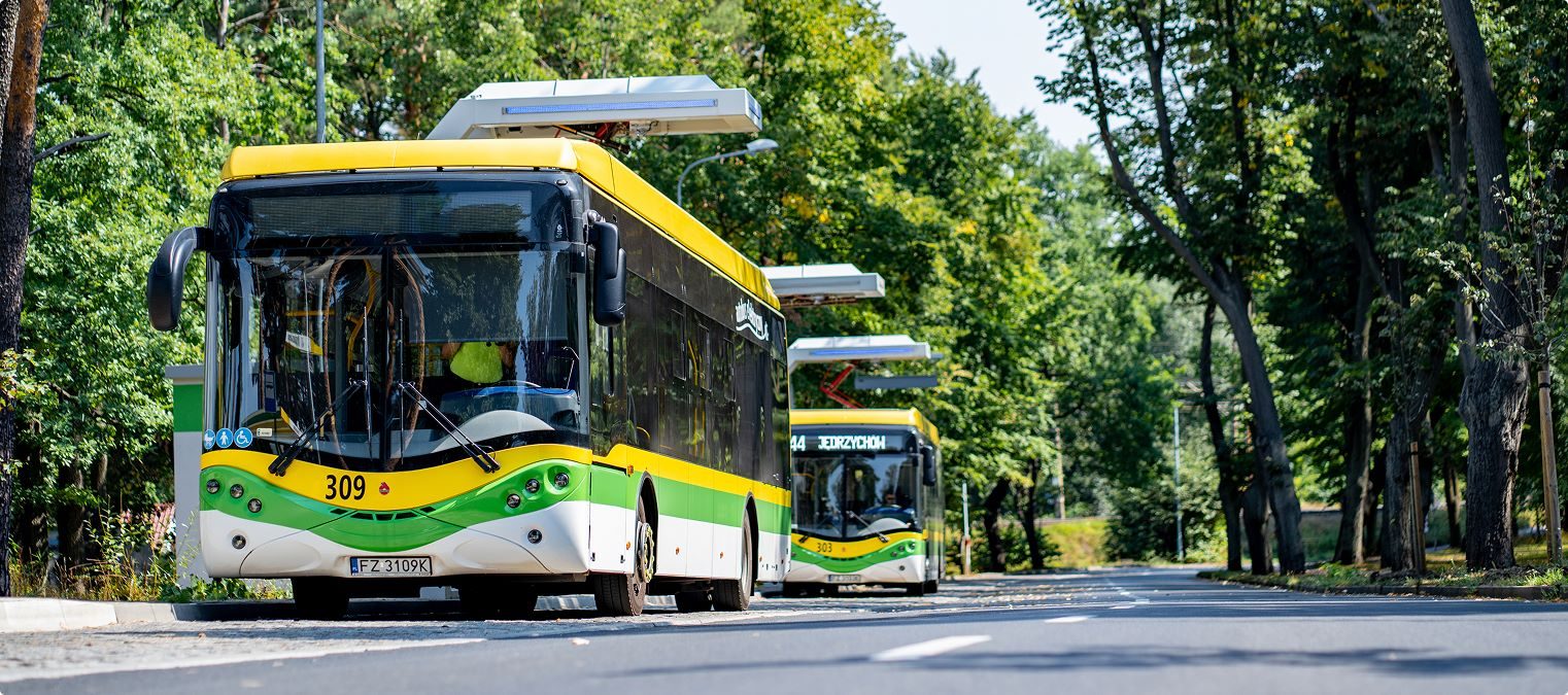 Electric buses charging under Ekoenergetyka overhead pantographs in Zielona Góra