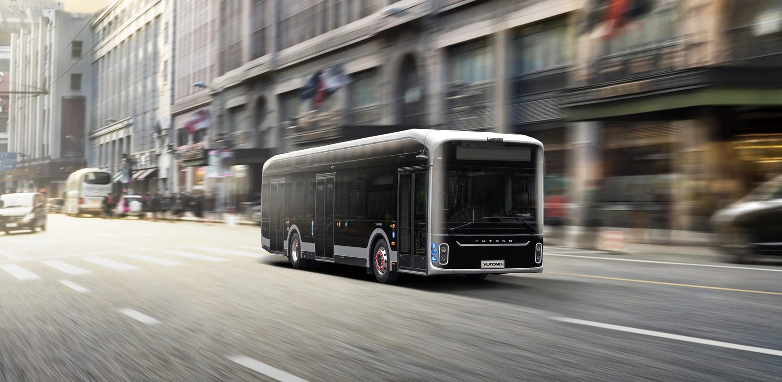 Yutong U12 driving through a city street, front three-quarter view